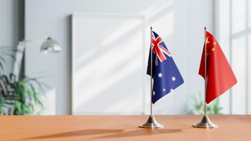 FLAGS OF AUSTRALIA AND CHINA ON TABLE