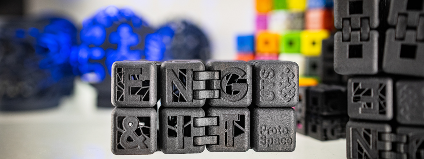 3D printed black infinity cube fidget toy featuring UTS, Eng & IT, and ProtoSpace logos