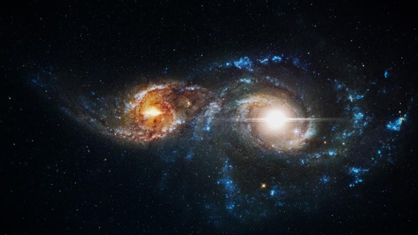 Two galaxies are merging together. 