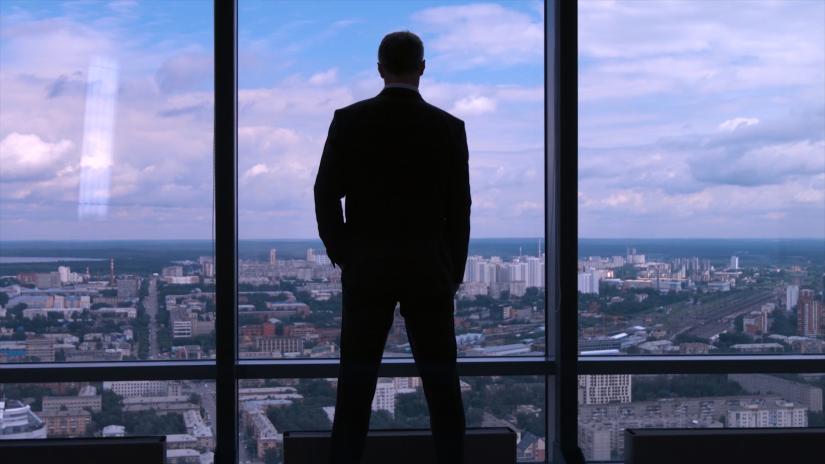 businessman at a large window