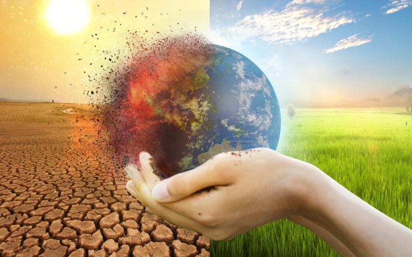 Graphic showing a hand holding the globe, one half barren and burning and the other fertile. Picture: Piyaset/Adobe Stock