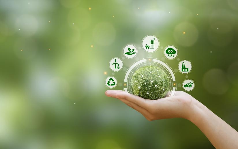Hand holding green earth with clean energy icon standing on eco friendly icon.  Picture: Antony Weerut/Adobe Stock