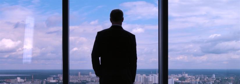 businessman at a large window