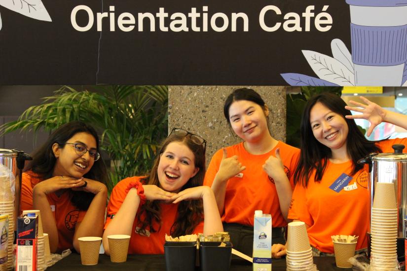 Four Peer Network volunteers serving coffee at the Orientation Cafe