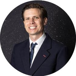 Joel Tozer smiling and looking at the camera