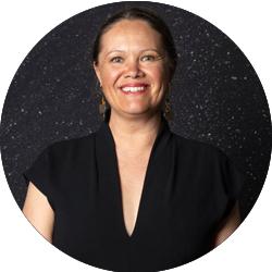 Mikaela Jade smiling and looking at the camera