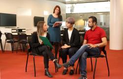 Teacher supervising students in a practice counselling session