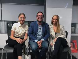 Rick posing with two journalism students