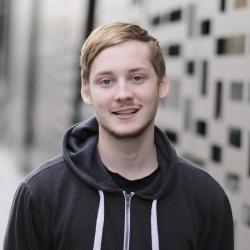 Bachelor of Science in Games Development student Jack Cooper in front of UTS Faculty of Engineering and IT building 