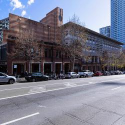 A long mid-height building with a heritage brick facade