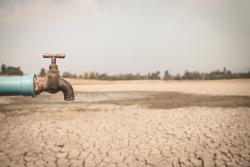 Tap with dry ground behind
