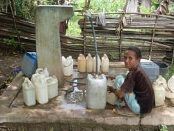 Woman collecting water in Timor-Leste