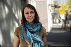 A woman wearing a blue scarf