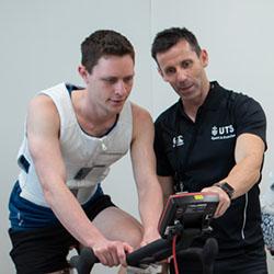 UTS Teacher instructing student on exercise bike