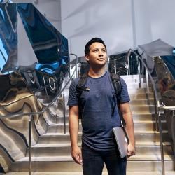 Student carrying laptop