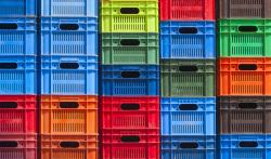 Colourful plastic crates stacked on top of each other