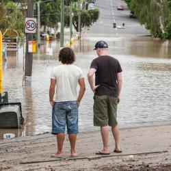 Men Observing Floodwate