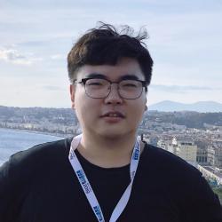 Headshot of PhD student Shuo Yang with coastal town scenery in background