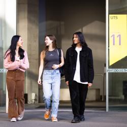 Students chat as they exit building 11