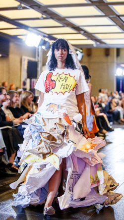 Model walking the runway in Bridget Matison dress design