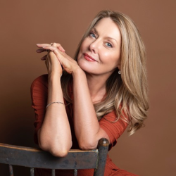 Image of Anna Funder sitting on chair