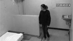 Sorry for your loss, woman walking in her prison cell