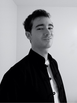 Man in a black jacket and white T shirt