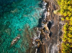 Aerial shot of sea meeting the shore.