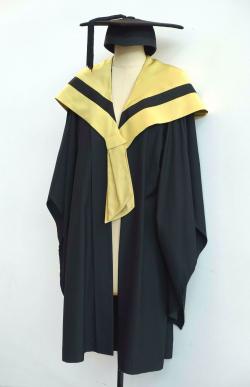 Black Bachelor gown, chartreuse Bachelor hood for Design, Architecture and Building and a black trencher