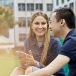 students chatting in a park