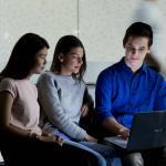 students looking at laptop