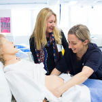 UTS Midwifery student and academic in lab classroom