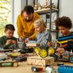 Classroom setting. Teacher, young children.
