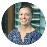 Dr Alison Bowers wearing blue floral shirt smiling at camera