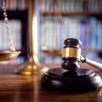 Wooden gavel on desk