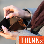 A woman's hands holding an empty purse