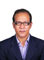 Chest up photo of Indra Mahlia looking at the camera