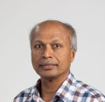 Chest up image of Jaya Kandasamy looking at the camera