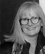 Black and white headshot of WHO director Michelle Rumsey
