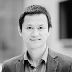 Jun Zhang smiling shoulders up photo