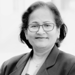 Renu Argawal smiling and has glasses on