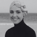 Woman at a beach smiling