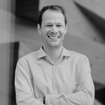 Man in a business shirt smiling