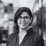 Woman with glasses smiling