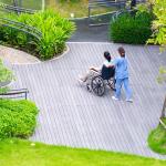 aged carer in garden